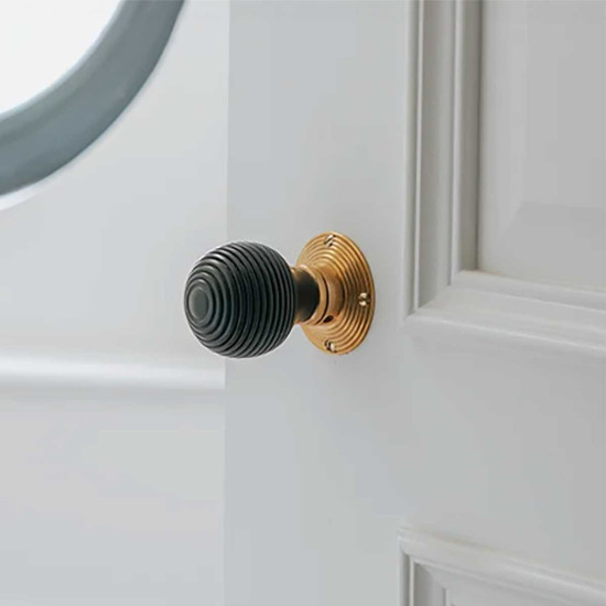 Beehive Ebony Knob Set with Aged Brass Roses