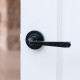 Traditional Blacksmith Avon Lever Door Handle on Round Rose Set - Sprung