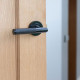Traditional Blacksmith Brompton Lever Door Handle on Round Rose Set - Sprung