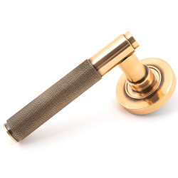 Polished Bronze Brompton Lever Door Handle on Round Rose Set - Unsprung