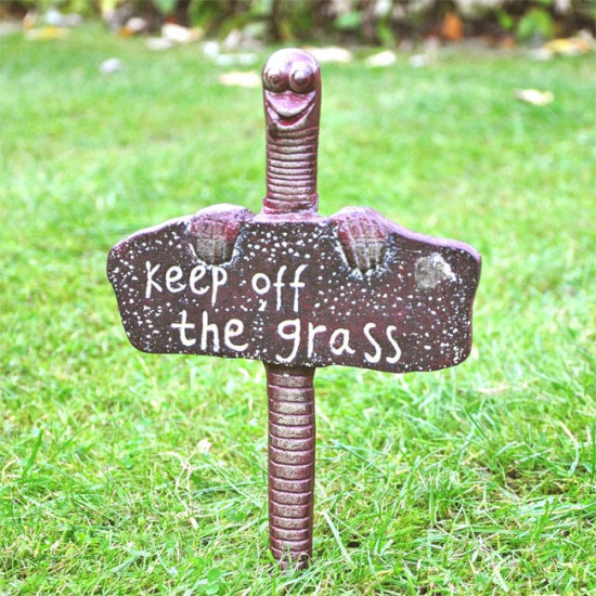 Keep off the grass sign worm spike