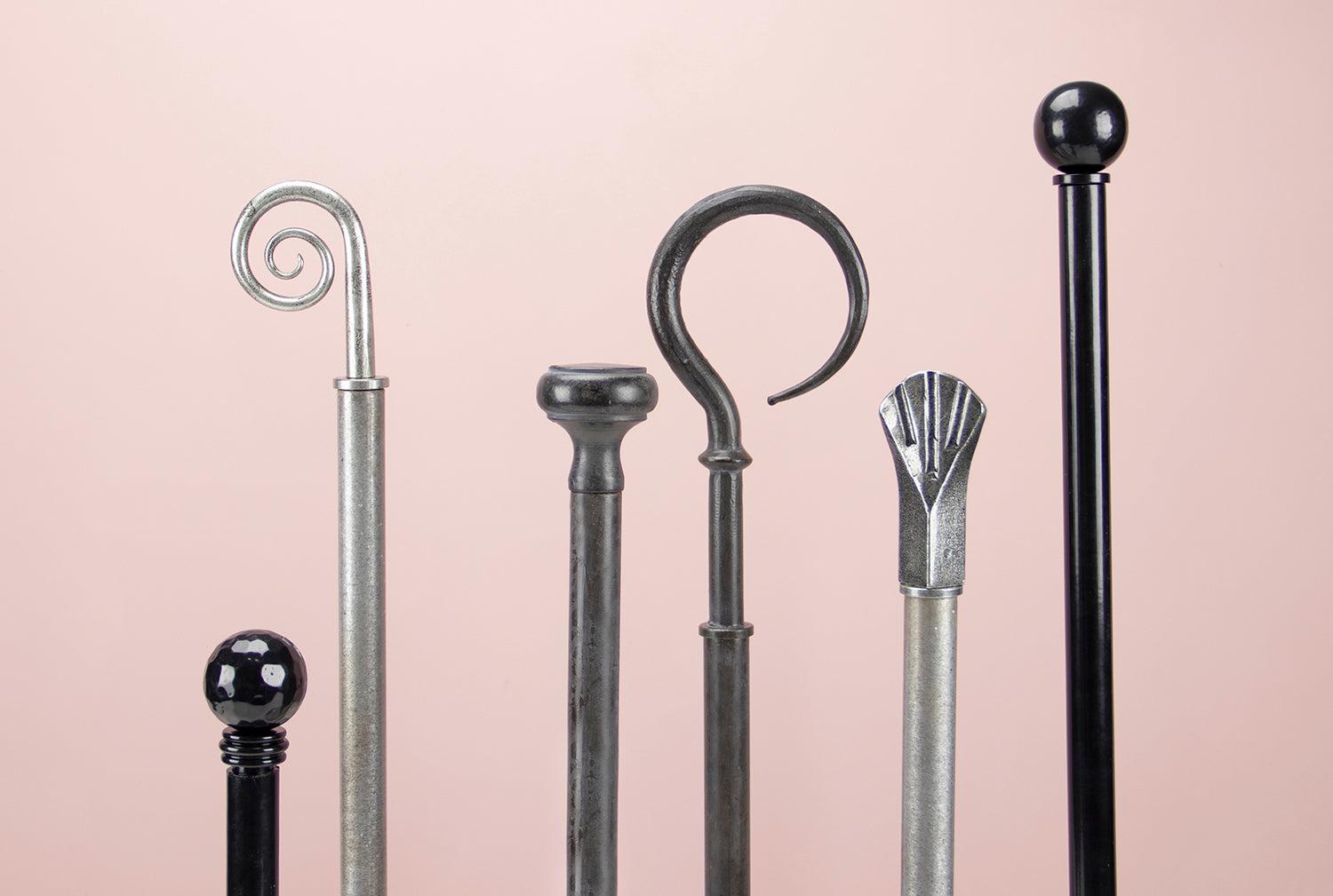 Black, pewter and beeswax curtain poles with finials