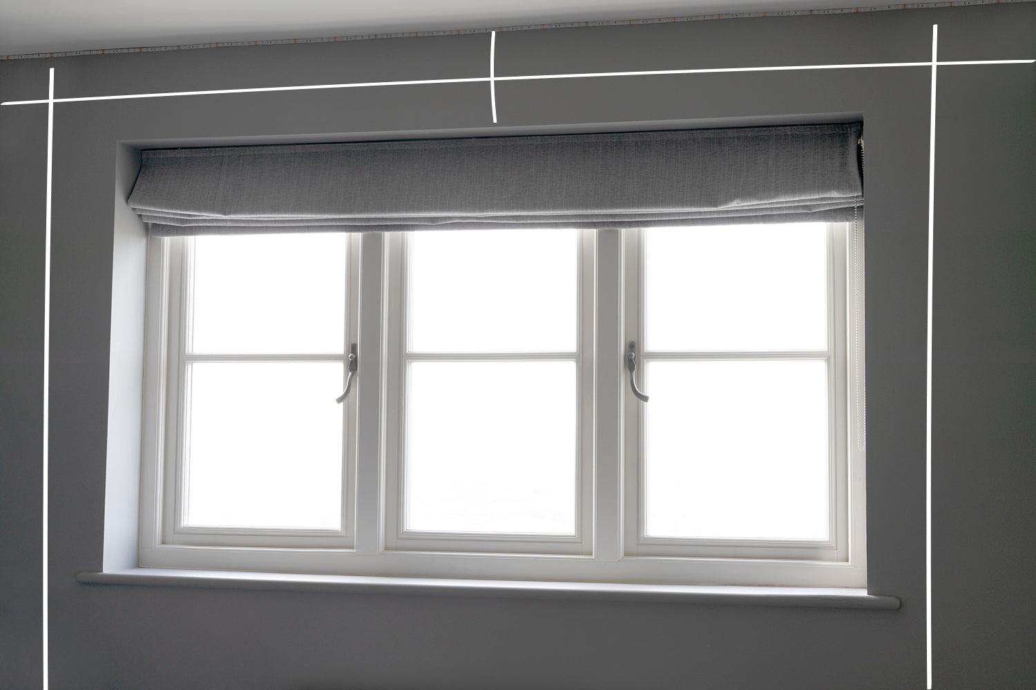 Measuring and marking curtain pole position above a window