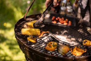 Grilled meat and vegetables on a Kadai bowl