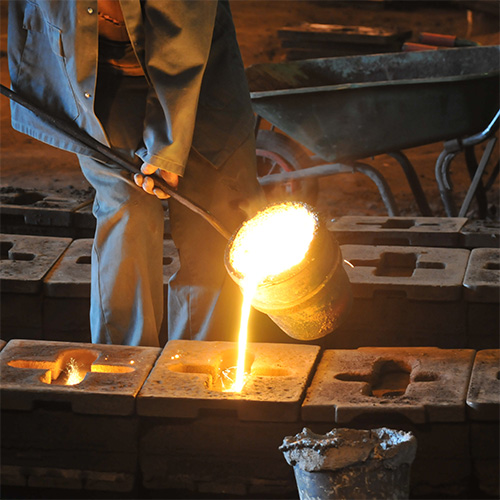 Man pouring cast iron