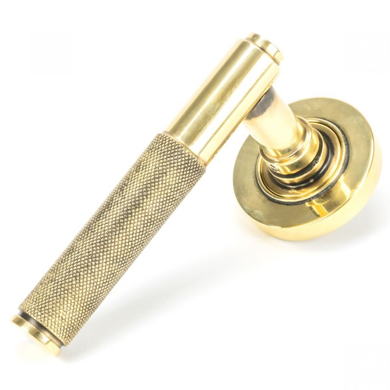Brompton Sprung Lever Door Handle on Round Rose Set - Aged Brass