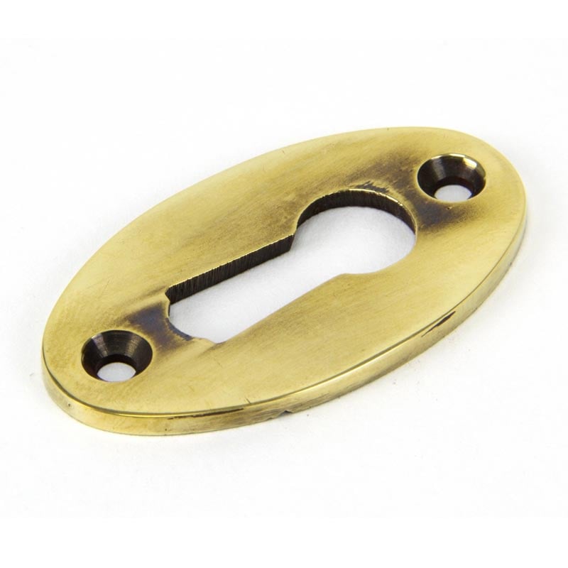From The Anvil Aged Brass Oval Escutcheon 83818